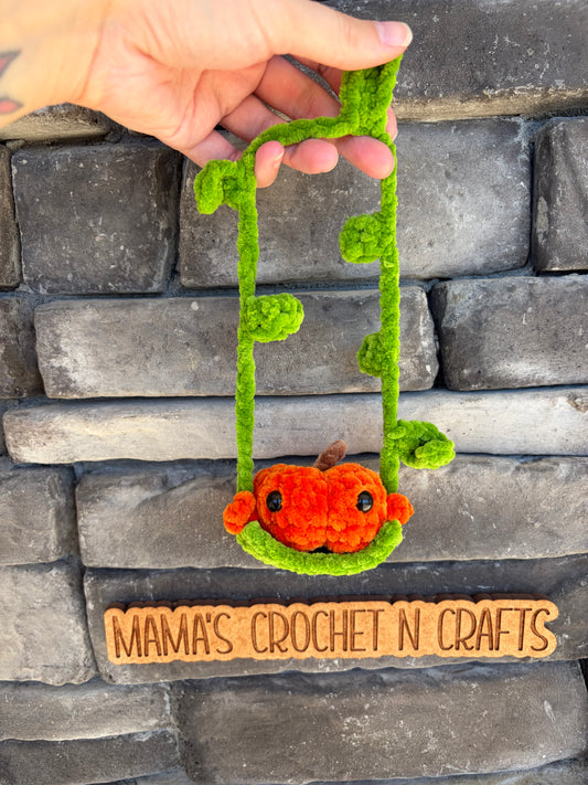 Pumpkin on a swing